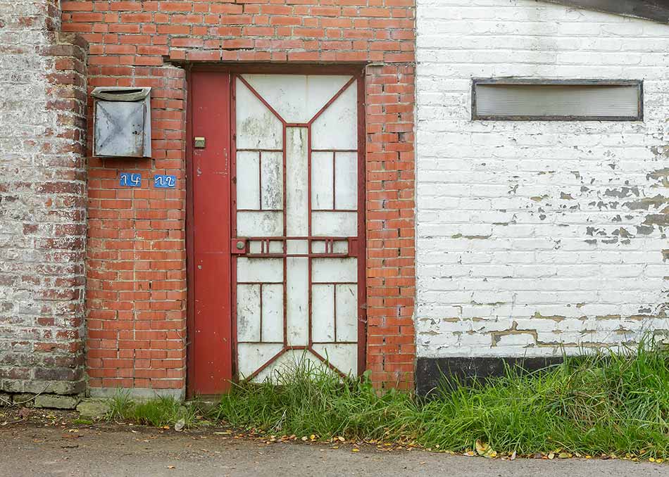 The geometric shapes in the front door of an abandoned house
