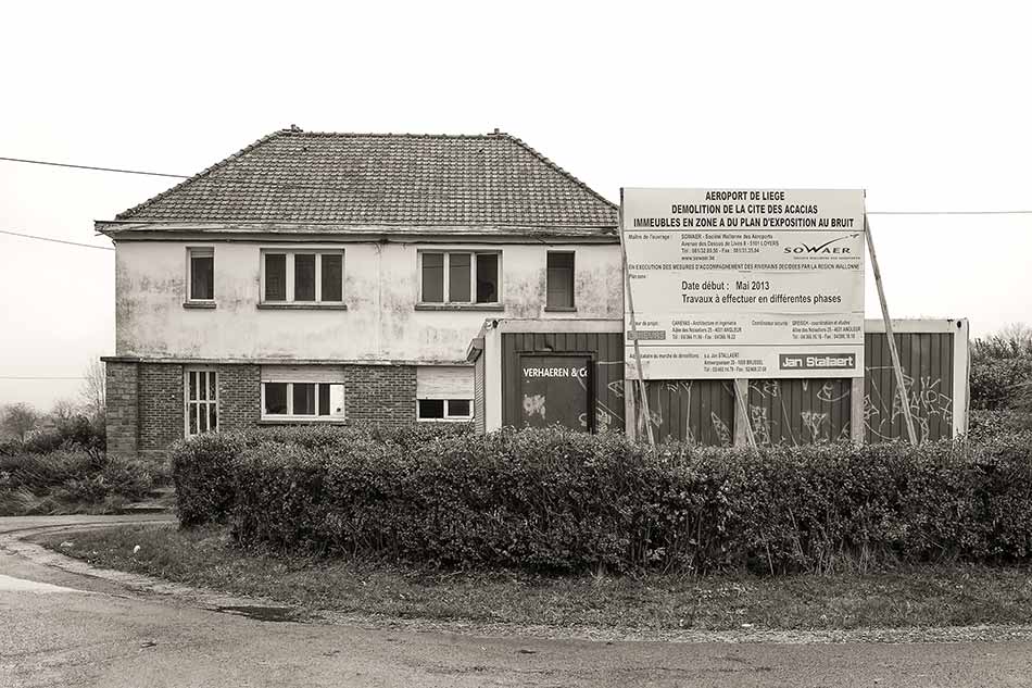 Information sign for a house being demolished for airport expansion