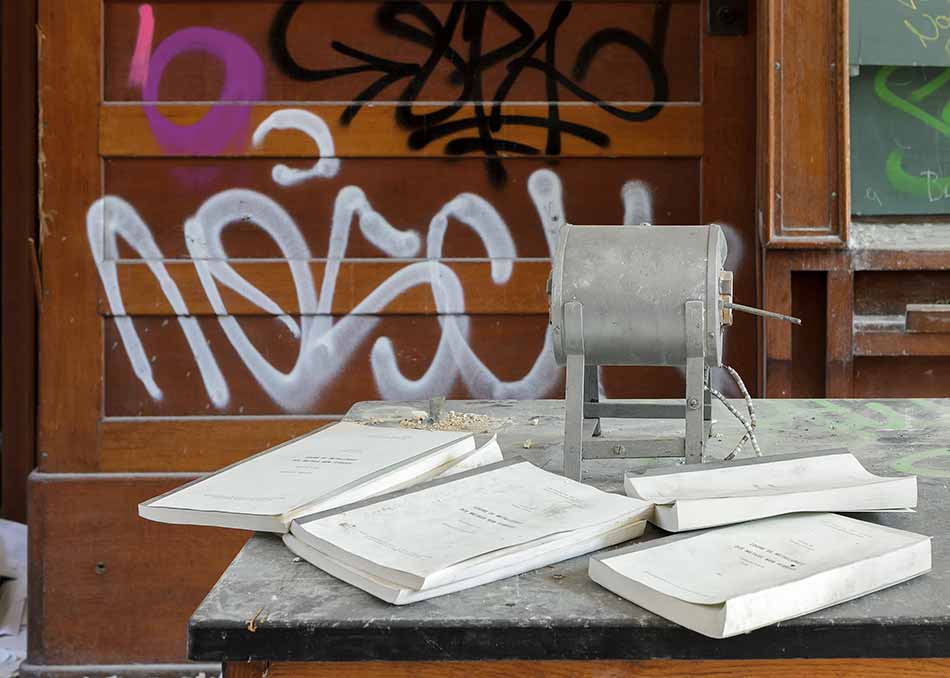 A deserted lecture hall with lecture notes on the table
