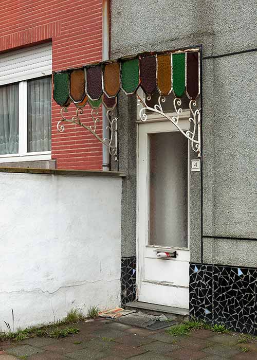 A front door with canopy in art deco style