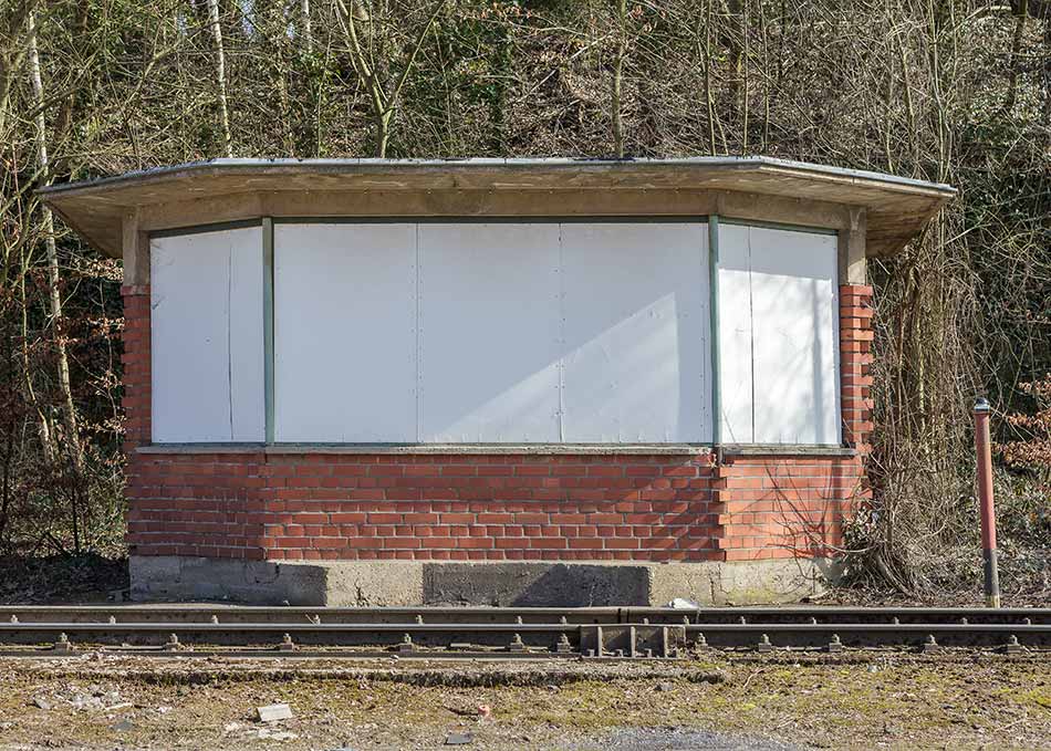 The blacked-out windows of an abandoned signal box