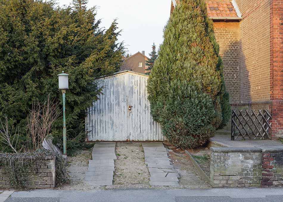 A house with a narrow garage not suitable for a Hummer