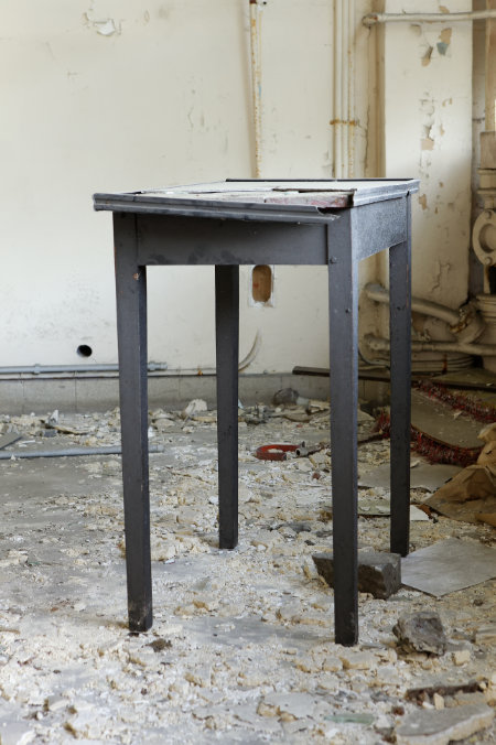 A little old table in an abandoned building