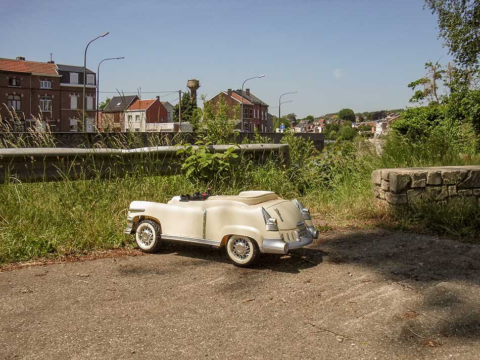 A toy car in a parking lot